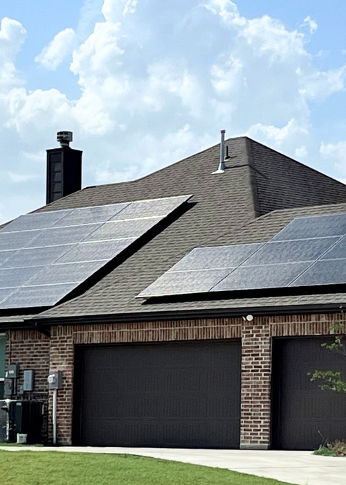 Residential solar panels on top of a home roof.